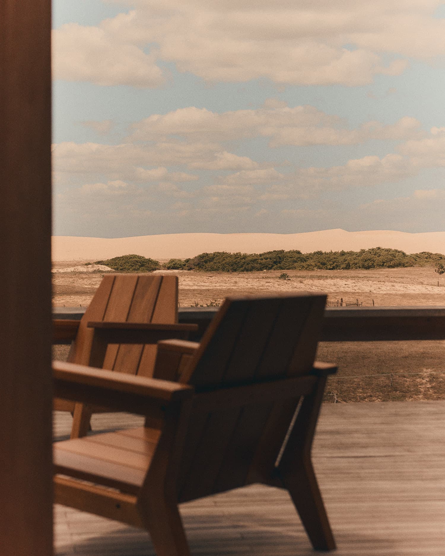 The veranda chairs, facing the dunes